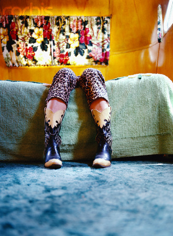 Relaxing on Bed in Cowboy Boots