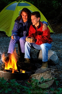 Couple In Front of Campfire