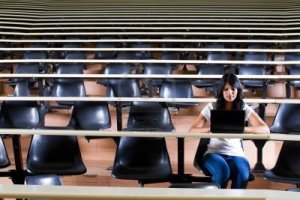 9843976-female-college-student-alone-in-university-lecture-hall