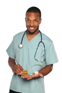 African American Health Professional With Prescription Pills